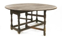 Lot 763 - A oak gateleg dining table