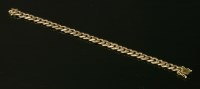 Lot 275 - A two colour gold curb link bracelet
