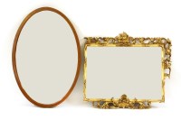 Lot 471 - A George III style carved and pierced giltwood wall mirror