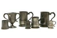 Lot 279 - A collection of pewter tankards and measures