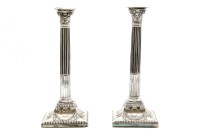 Lot 106 - A pair of silver plated corinthian column candle sticks