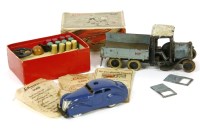 Lot 212 - A pre-war die-cast truck with tipping back and driver