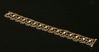 Lot 84 - An Edwardian gold and opal bracelet