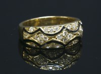 Lot 261 - A diamond and enamel gold tapered band ring