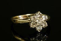 Lot 586 - A 9ct gold diamond daisy cluster ring