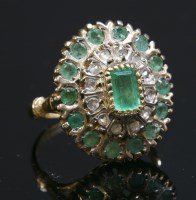 Lot 219 - An emerald and diamond oval cluster ring