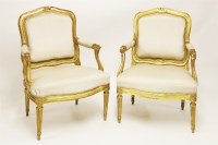 Lot 512 - A pair of Louis XVI period giltwood flat-backed fauteuils
