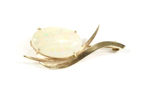 Lot 43 - A gold single stone cabochon opal spray brooch