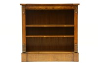 Lot 481 - A reproduction walnut low open bookcase