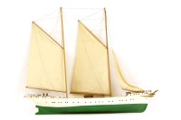 Lot 351 - A handmade and painted wooden model of a sailing ship