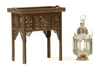 Lot 518 - A Moroccan carved hardwood tray top table