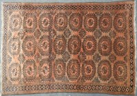 Lot 514 - A large Middle Eastern red ground carpet