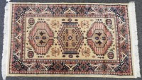 Lot 520 - A small yellow ground rug