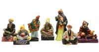 Lot 194 - A collection of seven Royal Doulton porcelain figures from the Middle Eastern traders series