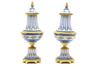 Lot 185 - A pair of 20th century Sevres porcelain and gilt metal urns