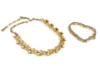 Lot 47 - A 9ct gold tri-colour kiss and bar link bracelet