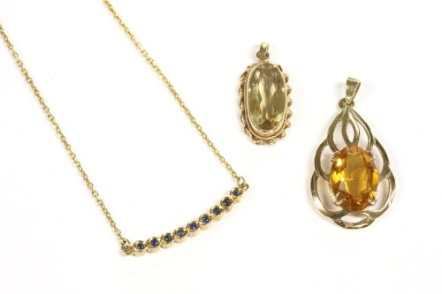 Lot 4 - A 9ct gold oval citrine pendant