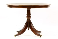 Lot 517 - A reproduction mahogany centre table