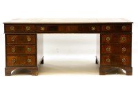 Lot 468 - A large reproduction mahogany partner's desk