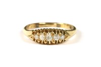 Lot 7 - An Edwardian gold five stone boat shaped graduated ring