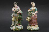 Lot 114 - A pair of early 19th century porcelain figures of a fruit picker and flower seller in traditional costumes