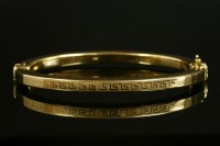 Lot 555 - An Italian square section hollow hinged bangle