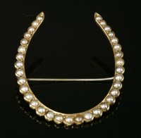 Lot 92 - An American gold split pearl horseshoe brooch