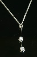 Lot 400 - An 18ct white gold two stone diamond Edna May pendant