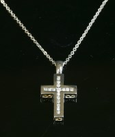 Lot 398 - An 18ct white gold diamond set cross and chain