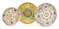 Lot 571 - Three Chinese famille rose plates