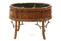 Lot 493 - A Regency style bamboo and tin lined oval jardiniere stand