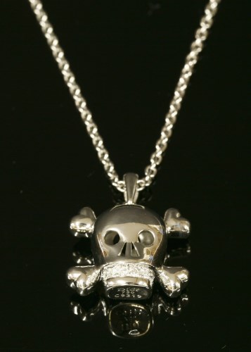 Lot 350 - A white gold Christian Dior 'Tete De Mort' diamond skull pendant