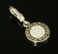 Lot 418 - A white gold Bulgari pavé set diamond pendant/charm