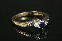 Lot 66 - A 9ct gold sapphire and diamond three stone crossover ring
