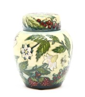 Lot 307 - A Moorcroft 'Fruit Garden' ginger jar and cover