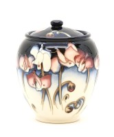 Lot 309 - A Moorcroft 'Wild Cyclamen' pot and cover