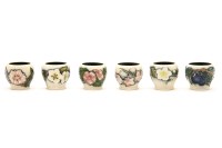 Lot 298 - A set of six Moorcroft 'Blossom Grove' egg cups