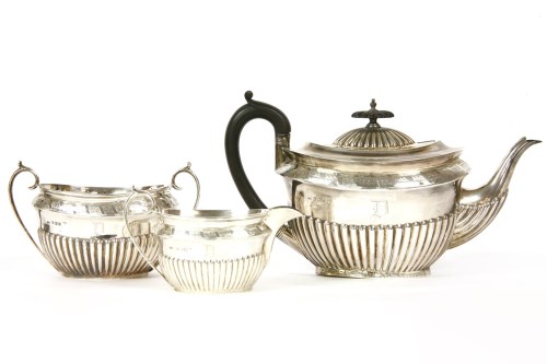 Lot 234 - A silver three piece tea set