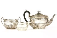 Lot 234 - A silver three piece tea set