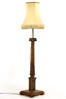 Lot 601 - A walnut standard lamp