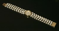 Lot 223 - A ladies' gold and cultured pearl mechanical cocktail watch