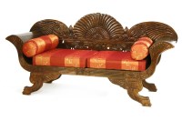 Lot 557 - An Indonesian hardwood settee