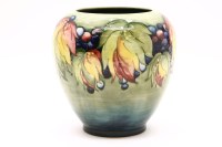 Lot 336 - A Moorcroft leaf and berry vase
