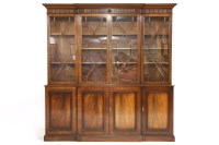 Lot 566 - A reproduction mahogany breakfront bookcase