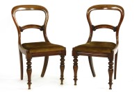 Lot 606 - A set of six Victorian mahogany balloon back dining chairs