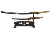 Lot 480C - A reproduction Japanese katana and wakizashi on a black lacquer stand