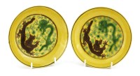 Lot 125 - A pair of Chinese Imperial porcelain yellow ground saucer dishes