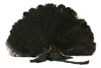 Lot 373 - A black ostrich feather fan