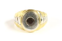 Lot 124 - An 18ct two colour gold single stone circular cut garnet ring