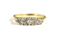 Lot 114 - A gold graduated five stone stone diamond ring